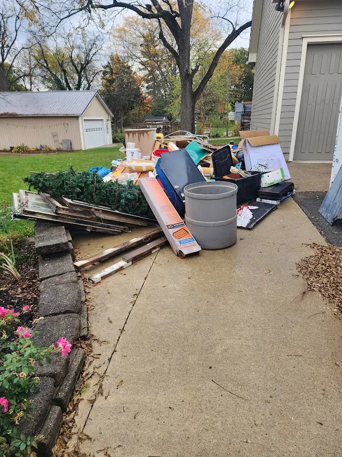 Dumpster being loaded with debris for 30 Yard Dumpster Rental in Largo